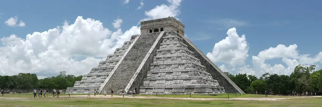El Castillo pyramid at Chichen Itza under a cloudy sky