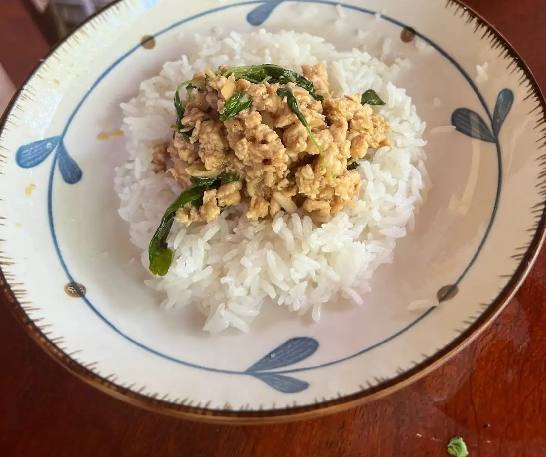 Plate of basil chicken over white rice